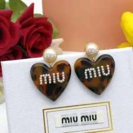 miu miu boucles doreilles pour femme s_1213a32